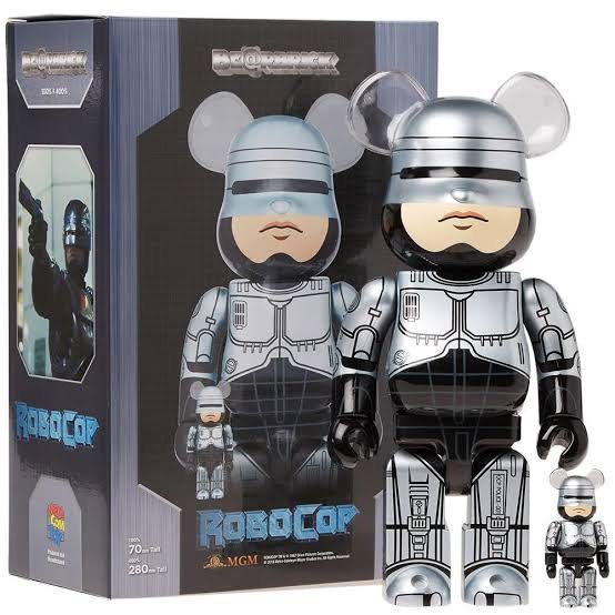 Medicom Toy Robocop Be@rbrick Figure (Category: Designer & Blind Box Toys) located in Quezon City. Submitted by shopakc (Listing ID 1406661190, Image 1). Description: - Medicom Toy Robocop Be@rbrick figure. - Features iconic Robocop design with a detailed metallic finish. - Includes original box with Robocop branding. - Figure sizes: 70mm and 280mm. - Includes a smaller version of the figure..