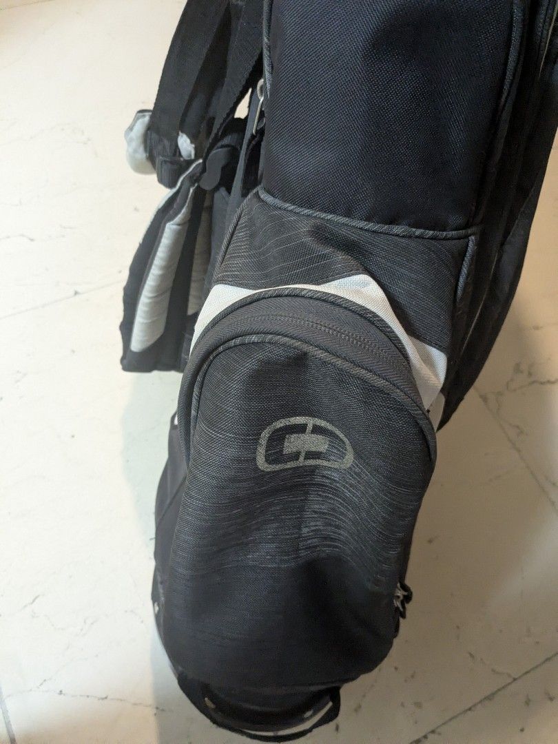 Ogio Golf Bag (Category: Golf) located in Makati City. Submitted by elmer.fudd (Listing ID 1406649134, Image 2). Description: in very good condition. all straps, zips and stand mechanism in working order. Rain hood zip needs repair. .