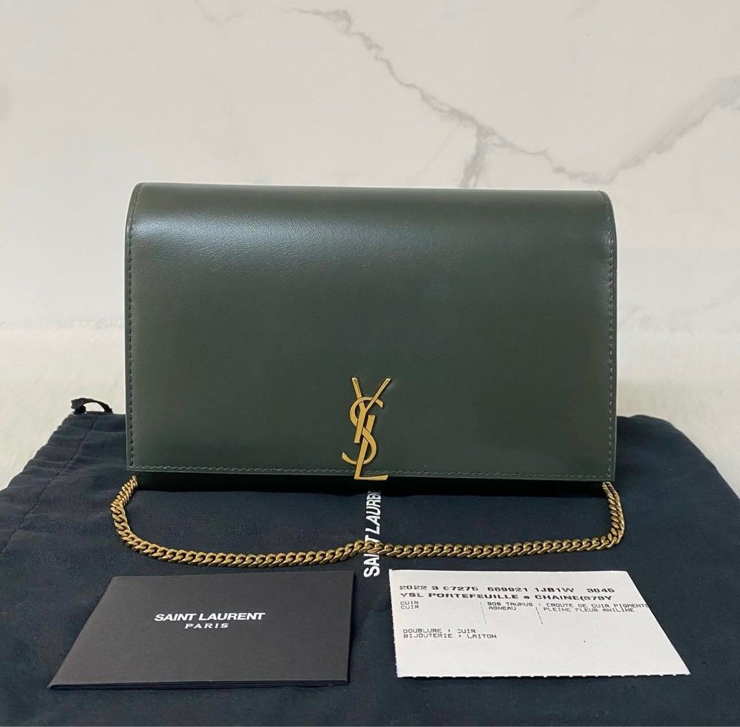 Saint Laurent Kate Chain Wallet (Category: Luxury Bags & Wallets) located in Los Banos. Submitted by capsule_closet (Listing ID 1406700475, Image 1). Description: - Saint Laurent Kate Chain Wallet - Color: Dark Green - Gold-tone YSL logo - Chain strap included - Includes authenticity cards and dust bag - Minimal signs of wear Actual photos are posted. Slightly negotiable. Bought from a legit seller on IG. 100% authentic. If buyer wants certificat
