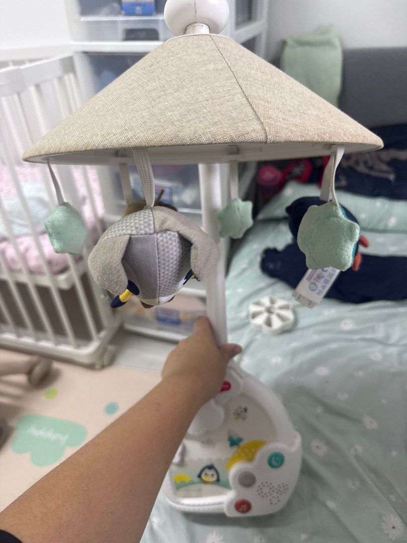 Tiny Love Mobile (Category: Infant Playtime) located in Singapore. Submitted by hellomrsxoxo (Listing ID 1406735913, Image 1). Description: - Gently used tiny love Mobile - Features soothing music and lights - Includes hanging toys for entertainment - Excellent working condition - Perfect for the nursery!.
