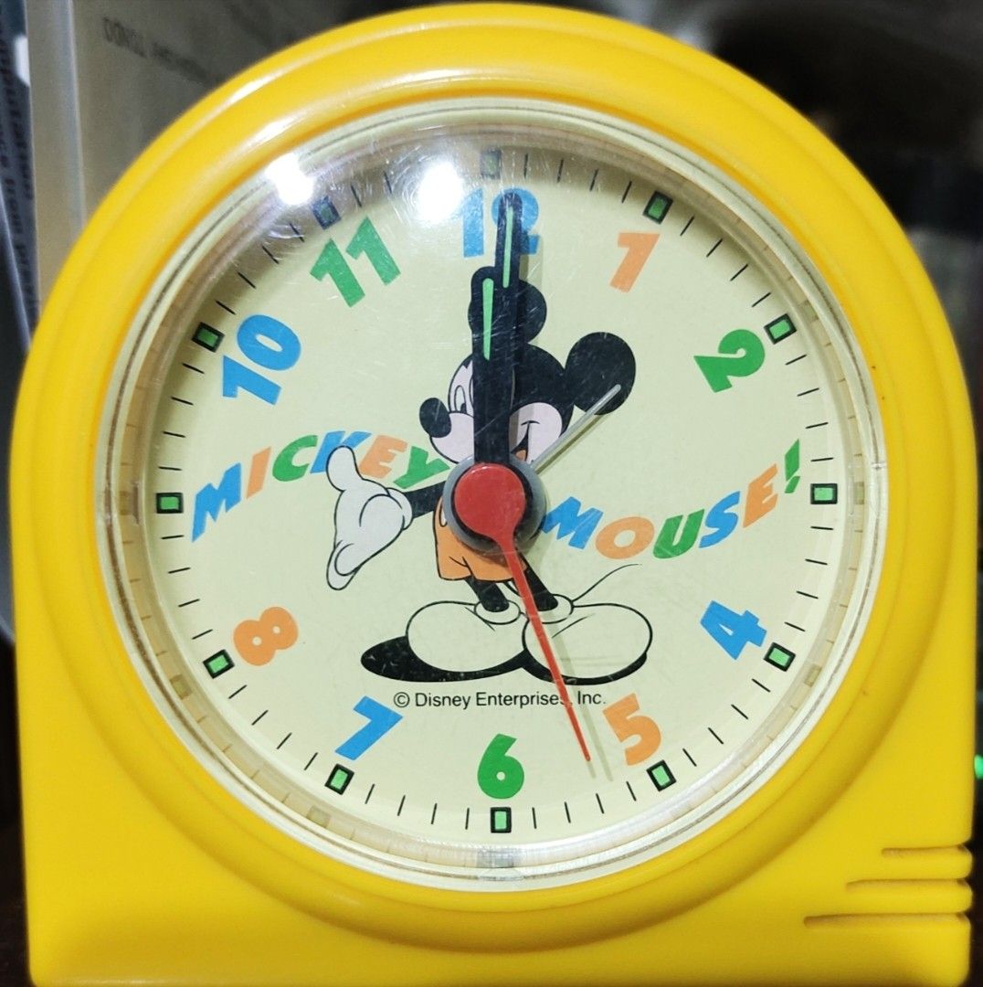 Vintage Mickey Mouse Alarm Clock (Category: Clocks) located in Manila. Submitted by garibochi (Listing ID 1406783024, Image 1). Description: - Vintage Mickey Mouse alarm clock - Features a yellow casing - Cream-colored face with Mickey Mouse design - Black hands and colorful numbers - Reads "Mickey Mouse!" on the face - Disney Enterprise Inc. product.