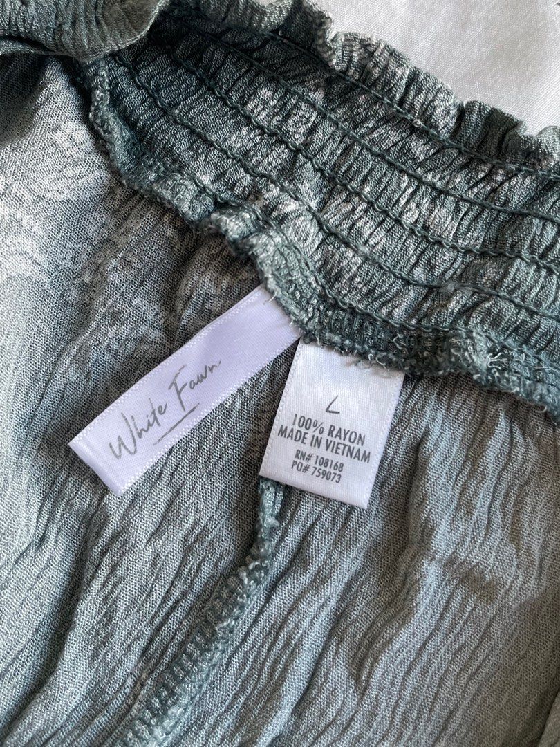 Sage Green Floral Off-Shoulder Top (Category: Blouses) located in Mandaue City. Submitted by midnight.skyes (Listing ID 1406712765, Image 2). Description: - White Fawn Off-Shoulder Top - Size: KIDS LARGE (Width: 16.5in, Length 17in) - Color: Blue-green - Design: White floral - Material: 100% Rayon - Features: Off-shoulder design, tie sleeves - Worn once.