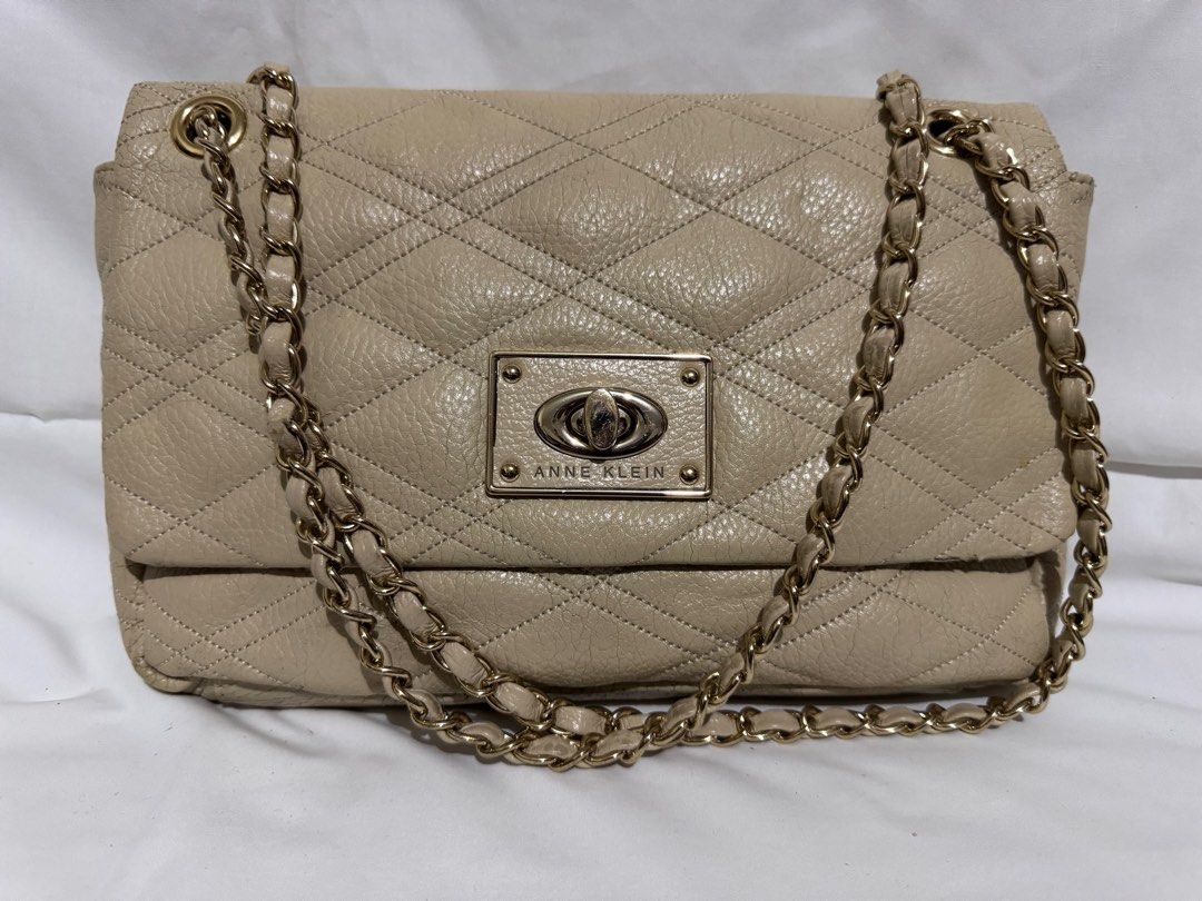 Anne Klein Quilted Shoulder Bag (Category: Shoulder Bags) located in Makati City. Submitted by tybexpress (Listing ID 1406990217, Image 1). Description: Decluttering! Note: there are cracks sa bottom ng bag, not noticeable pag suot ang bag Clean inside, good hardware - Anne Klein shoulder bag - Quilted design - Stylish chain strap - Secure flap closure with metal clasp - Interior: Main compartment and small zippered pocket - Versatile neutral col