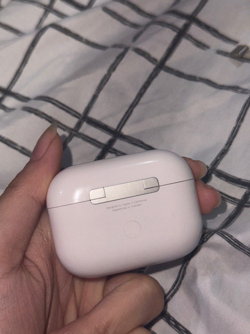 Apple AirPods Pro 2 (Category: Earphones) located in Angono. Submitted by xxxallaboutbagsxxx (Listing ID 1406938470, Image 3). Description: - Apple AirPods Pro with charging case - White color - Charging case with silver hinge and charging indicator light - Model number visible on the case - negotible!!.