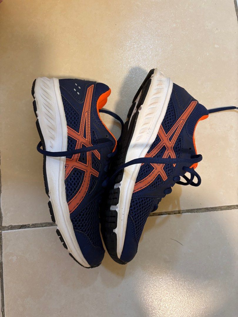 Asics Running Shoes - Navy Blue and Orange (Category: Sneakers) located in Quezon City. Submitted by gtancollection (Listing ID 1406835201, Image 2). Description: - Asics running shoes - Color: Navy blue and orange - Size: US 4, Euro 36 - Made in Cambodia - Features: Mesh upper, white sole, Asics logo - Condition: Some wear on soles - Ready to wear.