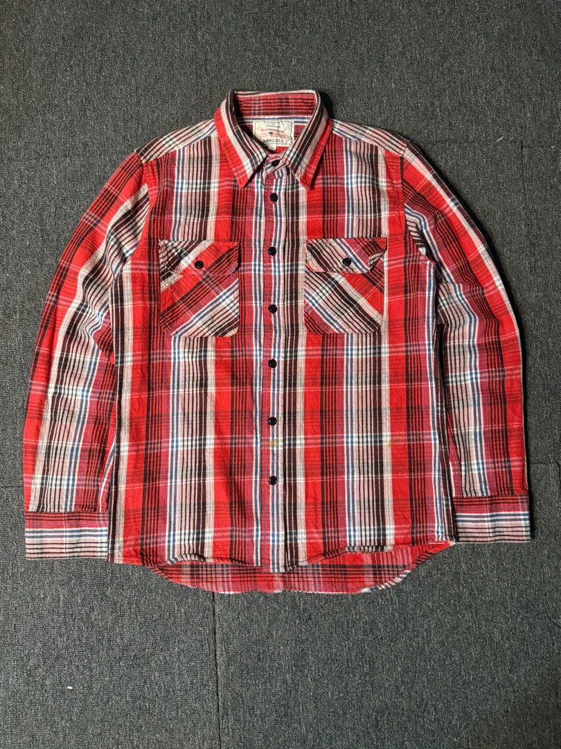 Avirex Plaid Flannel Shirt (Category: Tshirts & Polo Shirts ) located in San Marcelino. Submitted by SoloMain (Listing ID 1406877900, Image 1). Description: Authentic Avirex plaid flannel shirt. Features a classic red, white, and brown plaid pattern. Includes two chest pockets and a button-down front. The shirt is size M. There are washable stains on the bottom, but they are not very visible. Width is 20 inches and length is 26 inches..