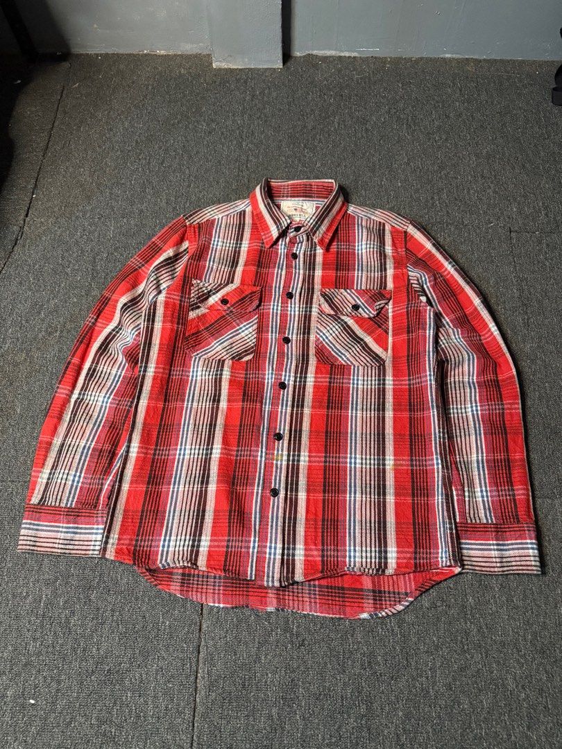 Avirex Plaid Flannel Shirt (Category: Tshirts & Polo Shirts ) located in San Marcelino. Submitted by SoloMain (Listing ID 1406877900, Image 2). Description: Authentic Avirex plaid flannel shirt. Features a classic red, white, and brown plaid pattern. Includes two chest pockets and a button-down front. The shirt is size M. There are washable stains on the bottom, but they are not very visible. Width is 20 inches and length is 26 inches..