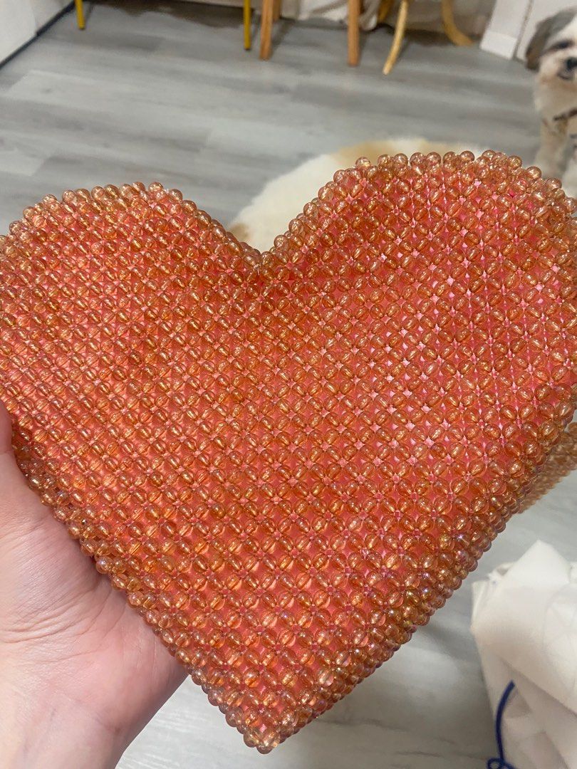 Beaded Heart Pink Bag (Category: Cross-body Bags) located in Pasig City. Submitted by snowmana.ph (Listing ID 1406873234, Image 2). Description: I purchased this from IG who customized beaded bags. If I remember correctly this cost me 800 to 1000 plus. Used once but zipper not working or damaged after using it from my trip. Selling area: Metro Manila only. Reason for Selling: Decluttering. Mode of Payment: GCash. Self-book delivery preferred. Ple