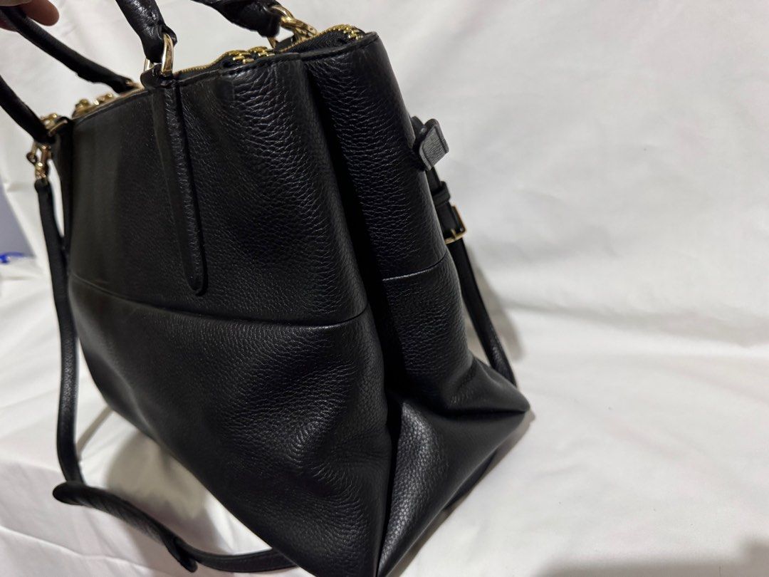 Coach Black Leather 2-way Bag (Category: Luxury Bags & Wallets) located in Makati City. Submitted by tybexpress (Listing ID 1406992169, Image 3). Description: Decluttering! - minimal flaw - Pwede sa maarte - 5 compartments, 3 zipper closure - Black leather handbag - Gold-tone hardware - Multiple zippered compartments - Detachable shoulder strap - Black fabric lining - Top handles - Front slip pocket - Pebbled leather texture.