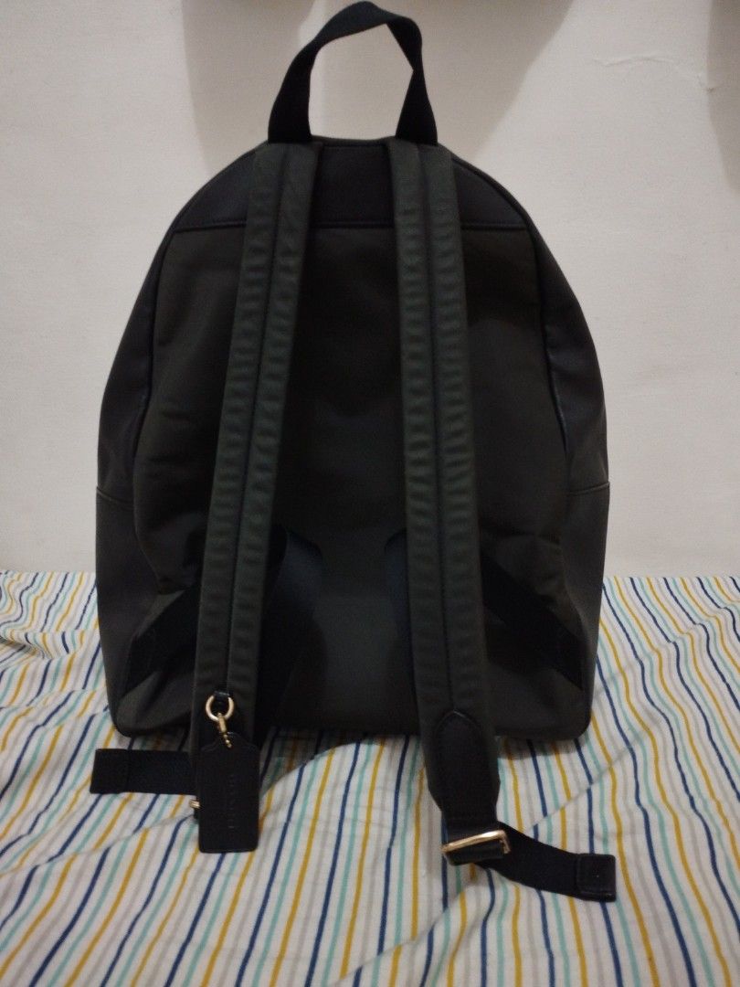 Coach Signature Backpack (Category: Luxury Bags & Wallets) located in Caloocan City. Submitted by shopaholic_cousins (Listing ID 1406915109, Image 2). Description: - Authentic Coach backpack - Signature Coach pattern - Front zippered pocket - Top handle - Adjustable shoulder straps - Zippered main compartment - Includes Coach hang tag - Includes care instructions - Coach label inside.
