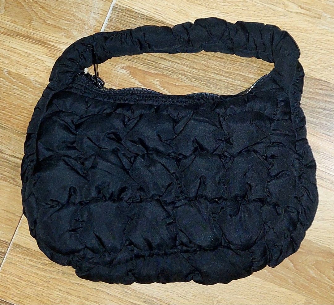 COS Quilted Handbag (Category: Luxury Bags & Wallets) located in Puerto Princesa. Submitted by YeSurJOMS (Listing ID 1406944429, Image 1). Description: - COS black quilted handbag - Single handle - Zippered closure - Lined interior - Unique quilted design - Includes COS tag.