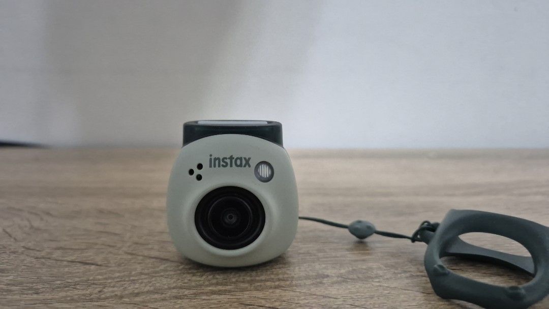 Instax pal Mini Camera (Category: Cameras) located in Pasig City. Submitted by magnoliafern (Listing ID 1406995922, Image 2). Description: Instax pal Mini camera NO BOX NO SD CARD has no issues. rfs - decluttering.not using the camera original price is from 6k to 7k - Built-in lens - Ring-shaped grip - Includes wrist strap - Well-maintained - Ready to use - Portable and compact.
