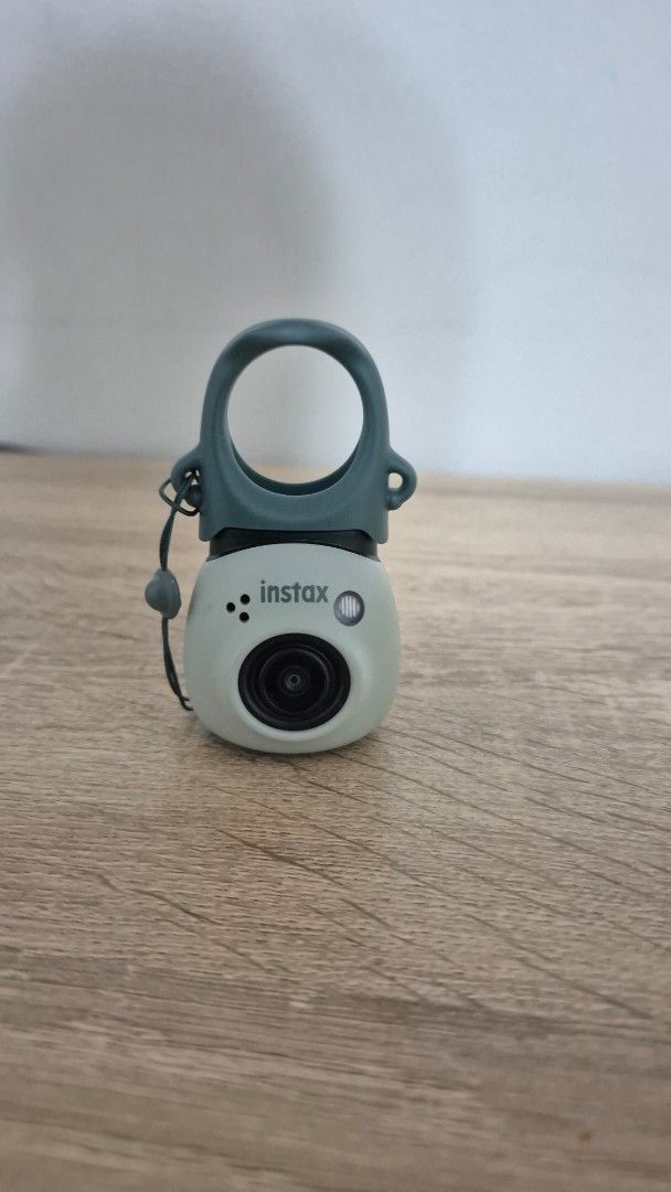 Instax pal Mini Camera (Category: Cameras) located in Pasig City. Submitted by magnoliafern (Listing ID 1406995922, Image 1). Description: Instax pal Mini camera NO BOX NO SD CARD has no issues. rfs - decluttering.not using the camera original price is from 6k to 7k - Built-in lens - Ring-shaped grip - Includes wrist strap - Well-maintained - Ready to use - Portable and compact.
