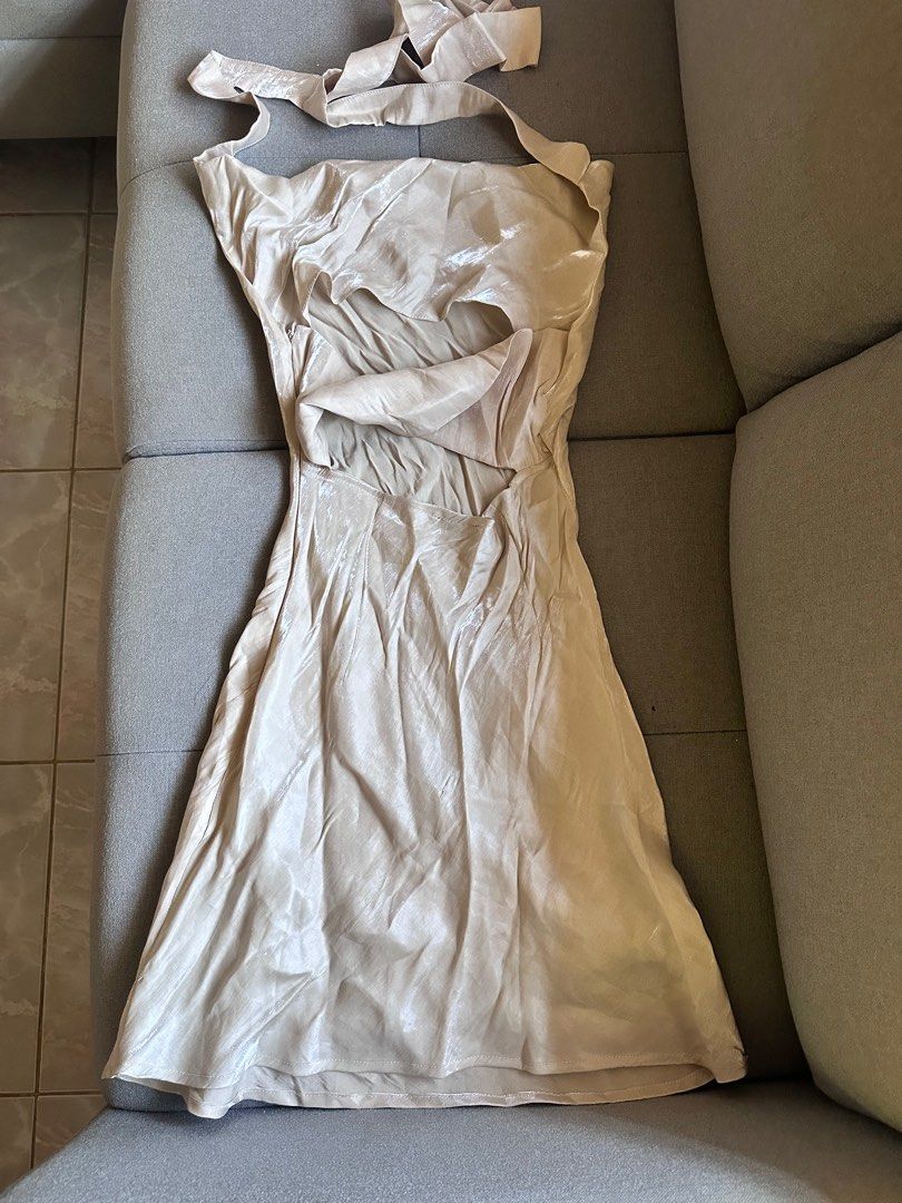 Iridescent Beige Halter Dress (Category: Dresses) located in Paranaque City. Submitted by dove.closet (Listing ID 1406834684, Image 2). Description: - Elegant beige halter dress - Flowing design - Flattering silhouette - Ideal for special events - Subtle sheen fabric.