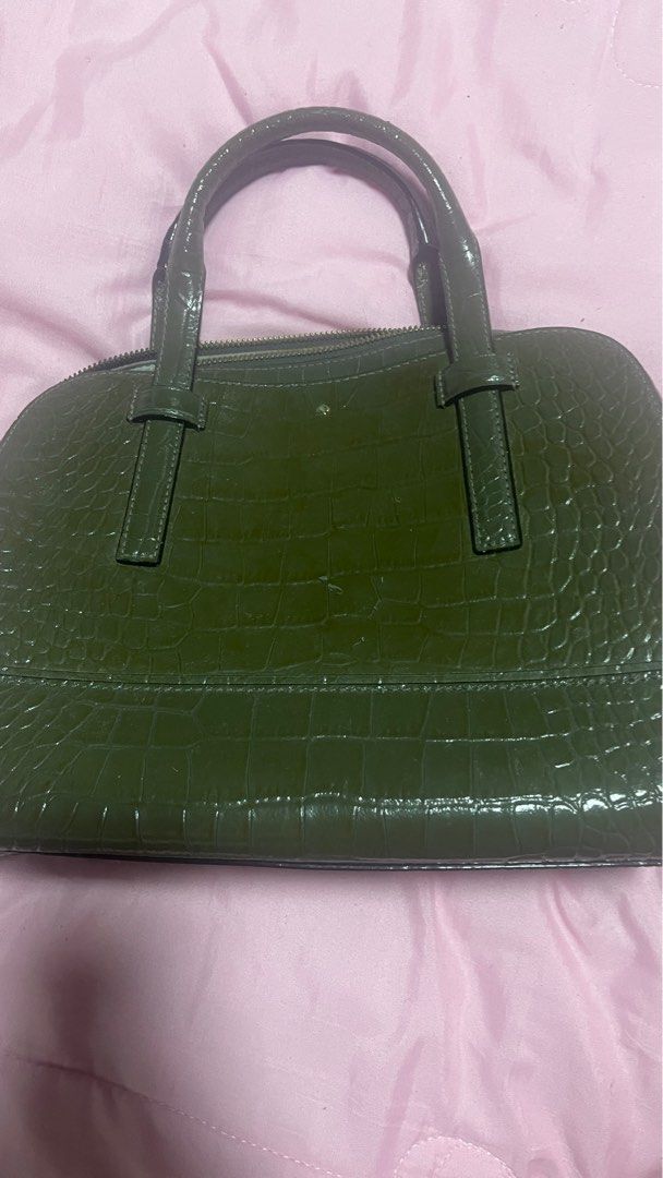 Kate Spade Green Handbag (Category: Luxury Bags & Wallets) located in Cabanatuan. Submitted by fabulousshoppe (Listing ID 1406923909, Image 1). Description: - Green textured handbag - Dome-shaped design - Top zipper closure - Dual top handles - Interior pocket - Includes Kate Spade label Minor Issue- no Sling included.