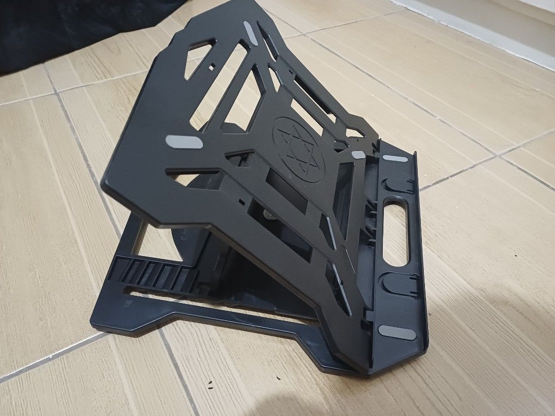 Laptop Stand - Various Designs (Category: Laptop Bags & Sleeves) located in Paranaque City. Submitted by potatoiceblended (Listing ID 1406873809, Image 3). Description: - Black metal stand with gray accents - Pair of wooden stands - Foldable black plastic stand - Elevates and angles your laptop - Improves ergonomics - Enhances airflow.