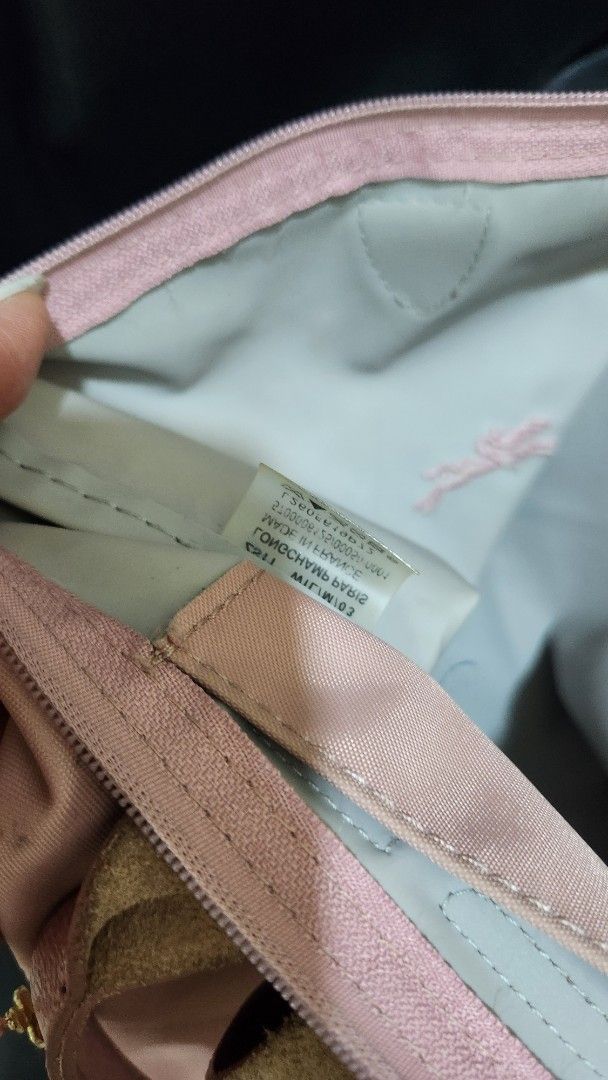 Longchamp Le Pliage Handbag (Category: Luxury Bags & Wallets) located in Manila. Submitted by summerstyled (Listing ID 1406958408, Image 3). Description: - Authentic pink Longchamp Le Pliage handbag - Top handle design - Secure flap closure - Interior label included - Zipper closure for added security - Spacious interior for your essentials.