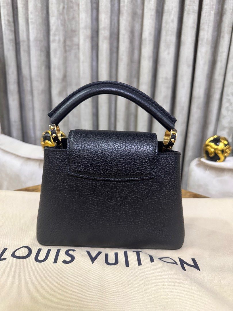 Louis Vuitton Capucines Mini Black Authentic (Category: Luxury Bags & Wallets) located in Makati City. Submitted by happyprelovedph (Listing ID 1406854707, Image 3). Description: Bought in US Complete Almost New No Flaws.