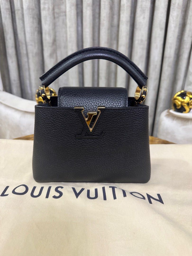 Louis Vuitton Capucines Mini Black Authentic (Category: Luxury Bags & Wallets) located in Makati City. Submitted by happyprelovedph (Listing ID 1406854707, Image 2). Description: Bought in US Complete Almost New No Flaws.