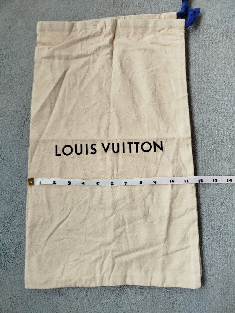 Louis Vuitton Dust Bag 2 for (Category: Luxury Bags & Wallets) located in Calamba. Submitted by merrymerida (Listing ID 1406886688, Image 2). Description: - Authentic Louis Vuitton dust bag - Beige fabric - Drawstring closure - Dimensions: Approximately 21 inches (height) x 14 inches (width) - Material: 100% cotton.