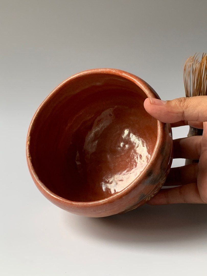 Matcha Bowl Chawan Red Orange Raku (Category: Coffee & Tea Tableware) located in Taguig. Submitted by gabagoolz (Listing ID 1406950012, Image 3). Description: -WITH MINIMAL CHIP GLAZED PAINT, SEE PHOTO, UNNOTICEABLE. -LOCATION: TAGUIG CITY -WE SHIP NATIONWIDE VIA J&T, SAME DAY DELIVERY VIA LALAMOVE OR GRAB. -PLEASE SCROLL THE PHOTOS TO SEE THE MEASUREMENT. -STRICTLY 1 DAY RESERVATION ONLY, FAILURE TO SETTLE THE PAYMENT, WE'LL AWARD IT TO THE 2ND 