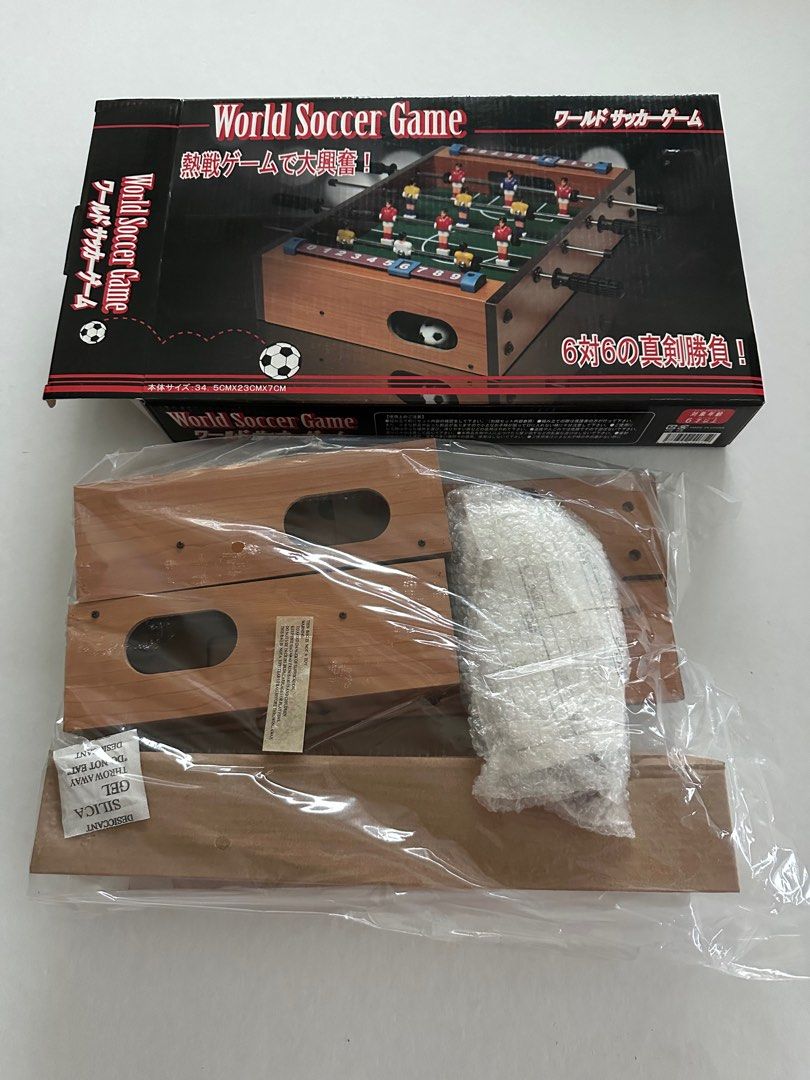 Mini Tabletop Foosball Game (Category: Board Games & Puzzles) located in Manila. Submitted by monica515 (Listing ID 1406955606, Image 2). Description: World Soccer Game is a tabletop foosball game (also known as table soccer). The game is a compact version of table football, with miniature players on rods that are used to move a ball and score goals..