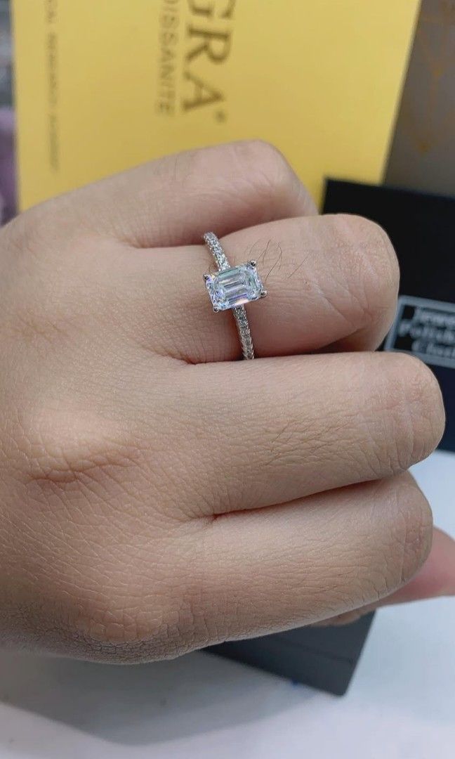 Moissanite Emerald cut Engagement ring 💍 (Category: Rings) located in Manila. Submitted by szairajewel (Listing ID 1406993812, Image 2). Description: with Certificate and Complete inclusion. size 4-5-6-7-8-9-10 Message me for more info. COD /self pick up.