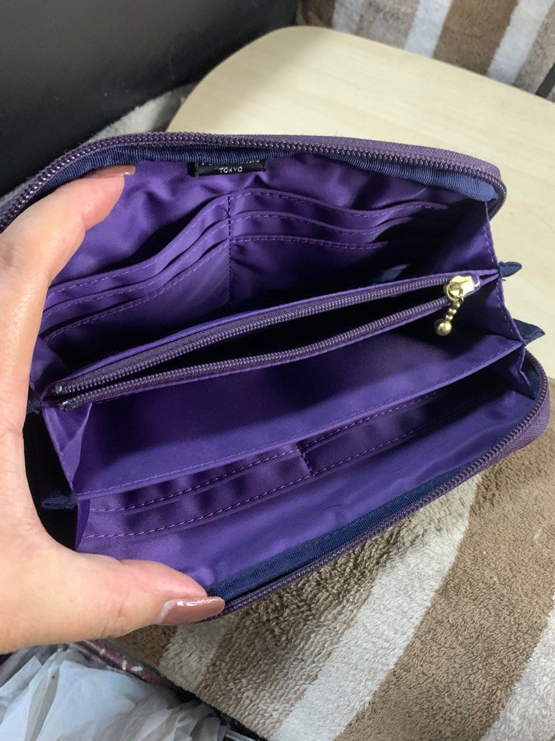 Porter Japan long zipped wallet (Category: Wallets & Card holders) located in Cabanatuan. Submitted by mjluxxejapan (Listing ID 1406832179, Image 3). Description: Fixed price. Approx 8”x4” meas dami pockets/slots very good cond may small penmark lang pls see all pixs posted dark purple color. Genuine leather matibay ganda ng quality .