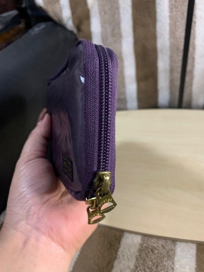 Porter Japan long zipped wallet (Category: Wallets & Card holders) located in Cabanatuan. Submitted by mjluxxejapan (Listing ID 1406832179, Image 2). Description: Fixed price. Approx 8”x4” meas dami pockets/slots very good cond may small penmark lang pls see all pixs posted dark purple color. Genuine leather matibay ganda ng quality .