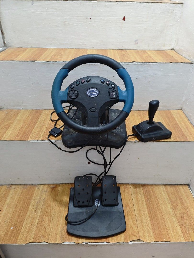 Ps2 Racing controller (Category: Controllers) located in Obando. Submitted by welhaseyo (Listing ID 1406842786, Image 1). Description: Untested since sold the ps2, been kept in its original box but its alreay flimsy and deteriorated .