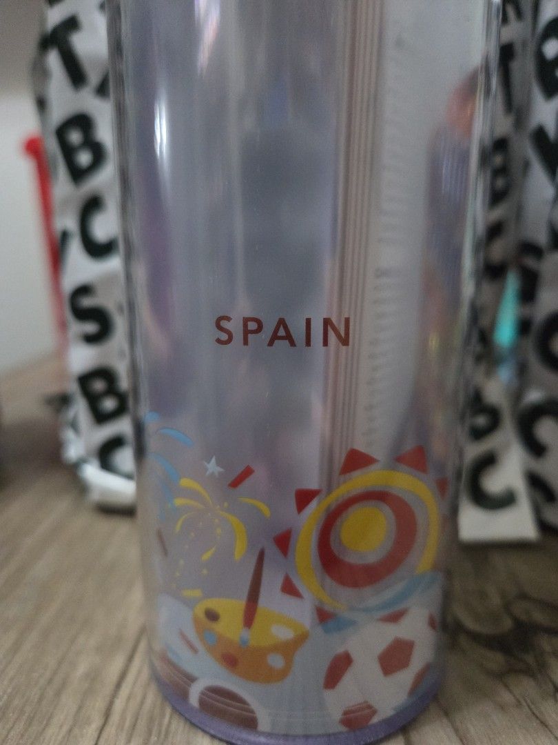 Starbucks Spain Tumbler (Category: Water Bottles & Tumblers) located in Manila. Submitted by sterling_grace (Listing ID 1406907372, Image 2). Description: - Starbucks Spain Travel Tumbler - Red lid, clear body - Features a design with sun, soccer balls, and fireworks - "SPAIN" printed on the side - Travel tumbler.