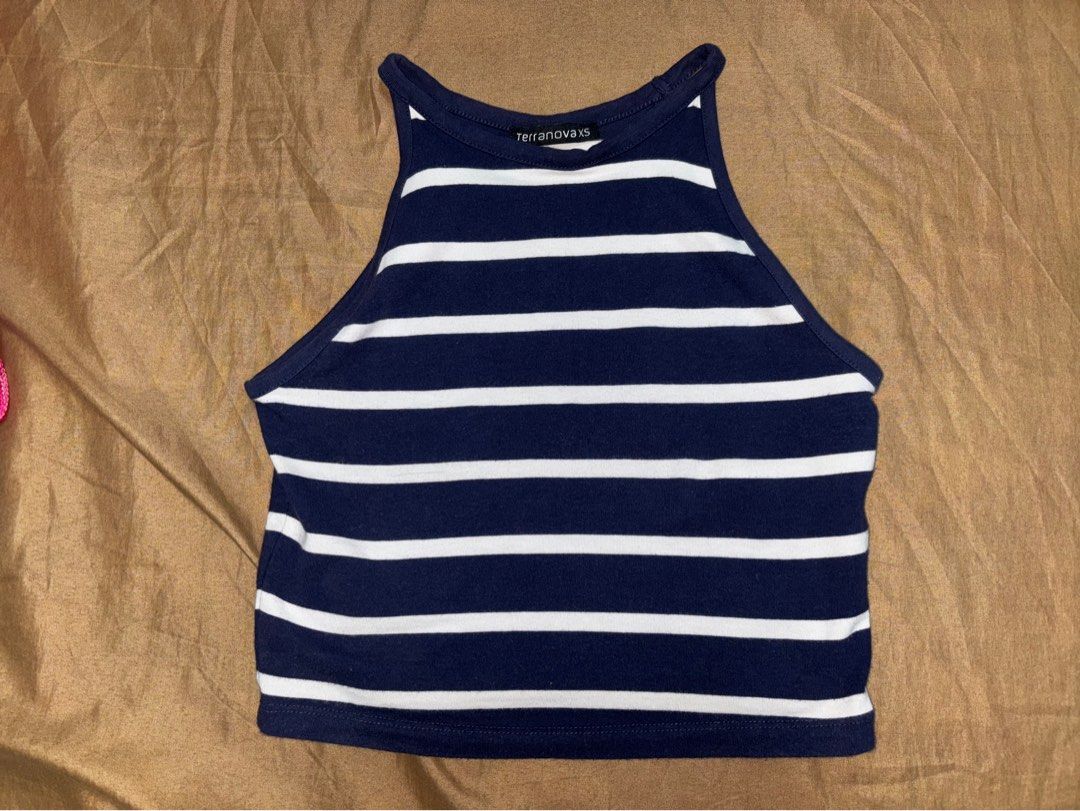 Terranova Striped Halter Crop Top (Category: Sleeveless) located in Angono. Submitted by kalidope (Listing ID 1406991408, Image 2). Description: - Terranova crop top - Navy blue and white striped design - Halter neck style - Cropped length - Made of soft, stretchy material - Versatile for various outfits: jeans, shorts, skirts - Perfect for casual wear or a night out.