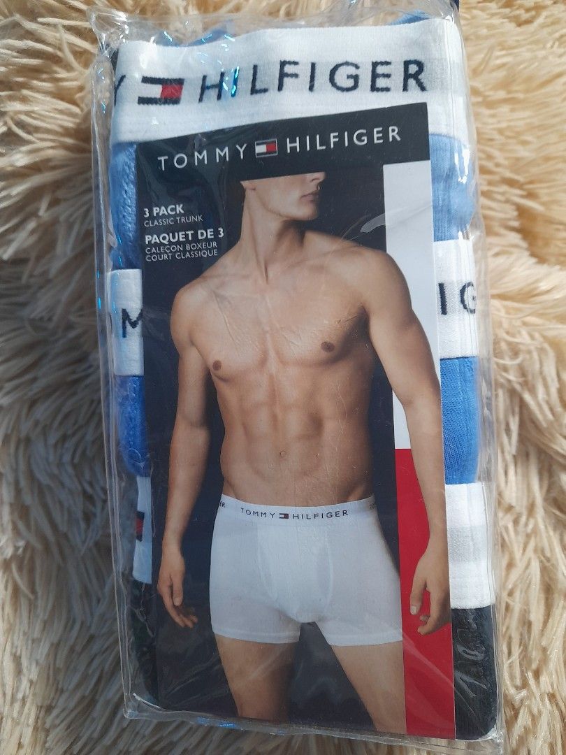 Tommy Hilfiger 3-Pack Classic Trunk (Category: Underwear) located in Pateros City. Submitted by armcandystuff (Listing ID 1406835946, Image 1). Description: 3-pack of Tommy Hilfiger classic trunk boxer briefs. The package includes three pairs of boxer briefs. The waistband features the Tommy Hilfiger logo. The boxer briefs are in a variety of colors, including white and blue. The packaging is still sealed..