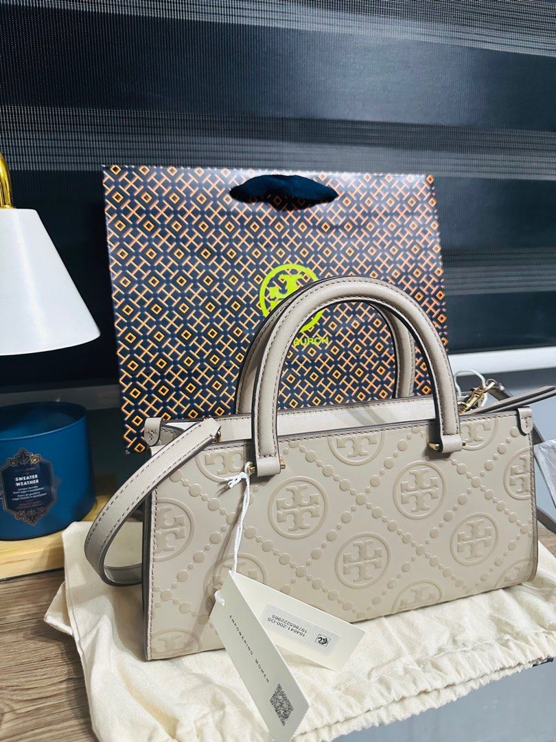 Tory Burch T-Monogram Embossed Small Tote (Category: Luxury Bags & Wallets) located in Porac. Submitted by bagitupshopph (Listing ID 1406816450, Image 1). Description: 💯 Authentic from 🇺🇸 *Retail item Brand new with tag, dust bag and paperbag Tory Burch Kira T-Monogram Embossed Small Tote in Fresh Clay Color and GHW Super nice Suede interior with one zip pocket and one slip pocket Can send more photos or video, message me. .