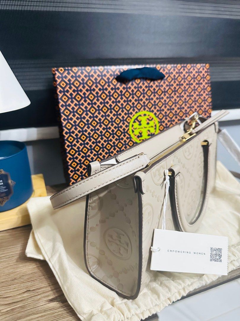 Tory Burch T-Monogram Embossed Small Tote (Category: Luxury Bags & Wallets) located in Porac. Submitted by bagitupshopph (Listing ID 1406816450, Image 3). Description: 💯 Authentic from 🇺🇸 *Retail item Brand new with tag, dust bag and paperbag Tory Burch Kira T-Monogram Embossed Small Tote in Fresh Clay Color and GHW Super nice Suede interior with one zip pocket and one slip pocket Can send more photos or video, message me. .
