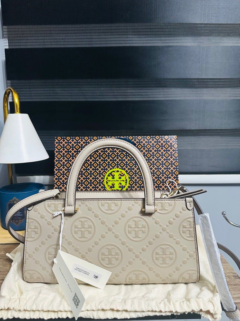 Tory Burch T-Monogram Embossed Small Tote (Category: Luxury Bags & Wallets) located in Porac. Submitted by bagitupshopph (Listing ID 1406816450, Image 2). Description: 💯 Authentic from 🇺🇸 *Retail item Brand new with tag, dust bag and paperbag Tory Burch Kira T-Monogram Embossed Small Tote in Fresh Clay Color and GHW Super nice Suede interior with one zip pocket and one slip pocket Can send more photos or video, message me. .
