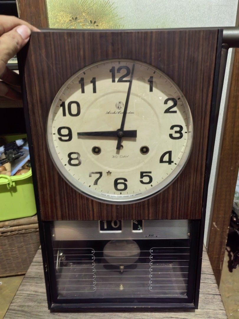 Vintage Mechanical Clock (Category: Clocks) located in Cebu City. Submitted by dudes_villanueva (Listing ID 1406852648, Image 2). Description: Vintage Mechanical Clock Brand: Aichi 📌Calendar Mechanical Clock 📌Working Chime 📌Was not able to run the clock in full test. Minute hand moves during pendulum swing. Sold as is. 📌Body in good condition. 📌Complete with Key L10xW4xH17 inch.