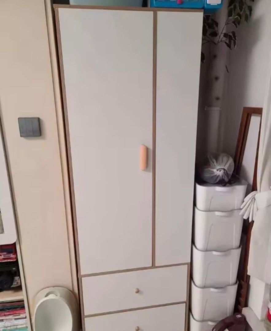 White Wooden Wardrobe with Drawers (Category: Shelves, Cabinets & Racks) located in Manila. Submitted by nhi_nin (Listing ID 1406877476, Image 3). Description: Stylish white wooden wardrobe with a combination of open shelves, a hanging rod, and two drawers. Features a clean design with a light wood trim. The wardrobe is 180cm tall, 60cm wide, and 40cm deep. Perfect for organizing clothes and other items. Includes a door and drawers for added stor