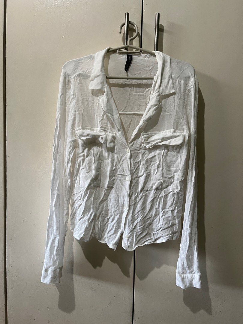 Zara White Long Sleeve Shirt (Category: Longsleeves) located in Marikina City. Submitted by moonchok (Listing ID 1406889544, Image 1). Description: - Zara white long sleeve shirt - Collared neckline - Two front pockets - Button-down closure - Long sleeves with cuffs - Lightweight fabric - worn twice - super comfy! - needs iron.