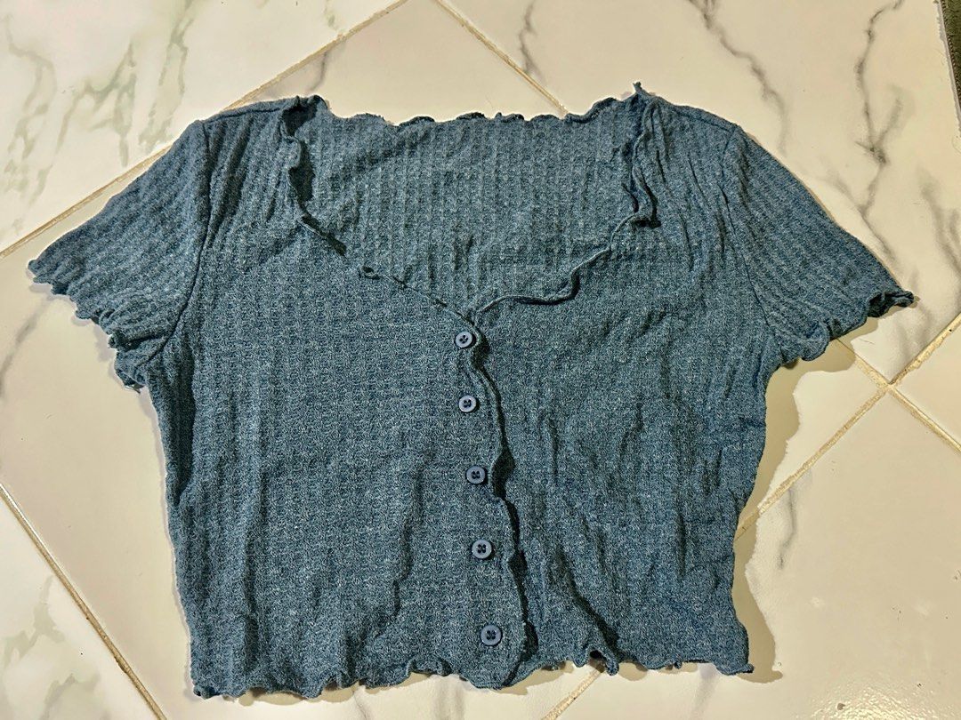 Blue Ribbed Button-Up Top (Category: Sleeveless) located in Manila. Submitted by cchaiprincess (Listing ID 1401948460, Image 1). Description: - SHEIN Blue Ribbed Button-Up Top - Size: S - Condition: Good - Features: Ribbed texture, button-up design - Perfect for casual wear.