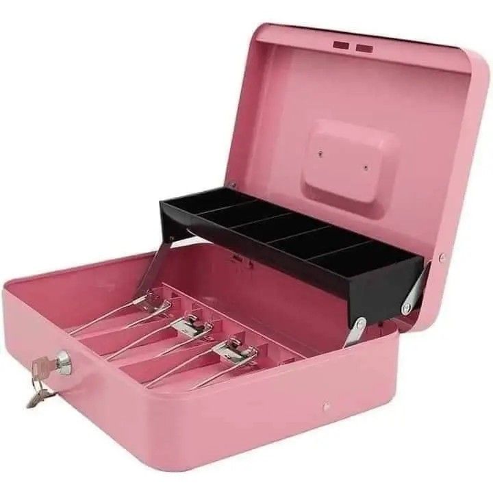Cash box (Category: Storage Boxes & Baskets) located in Manila. Submitted by jelai.cybyb (Listing ID 1402049585, Image 2). Description: Metal cash box features a removable tray for organizing coins and a secure lock with a key. It has multiple compartments for bills and a separate section for smaller items. Available in black, pink, and blue. Perfect for small businesses, events, or personal use to keep your cash safe and organized..