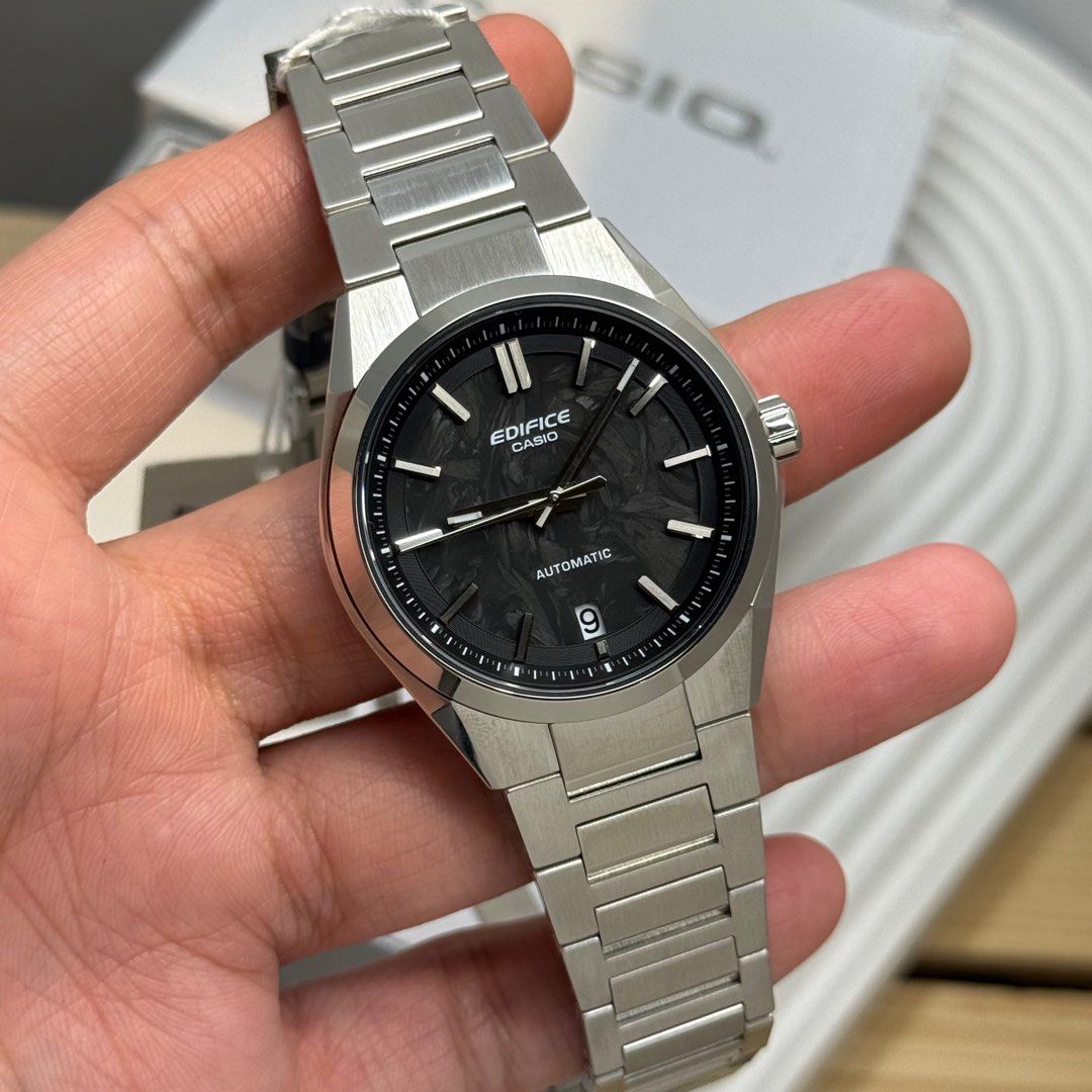 Casio Edifice EFk-100CD Automatic watch (Category: Men's Watches) located in Quezon City. Submitted by micoyski (Listing ID 1402065665, Image 3). Description: Edifice Casio automatic watch with stainless steel strap. Available in three dial colors: black, blue, and green. Features a date display. The watch is new and comes with its original box and tags. The watch has a sleek, modern design suitable for everyday wear. Sapphire glass 39mm.