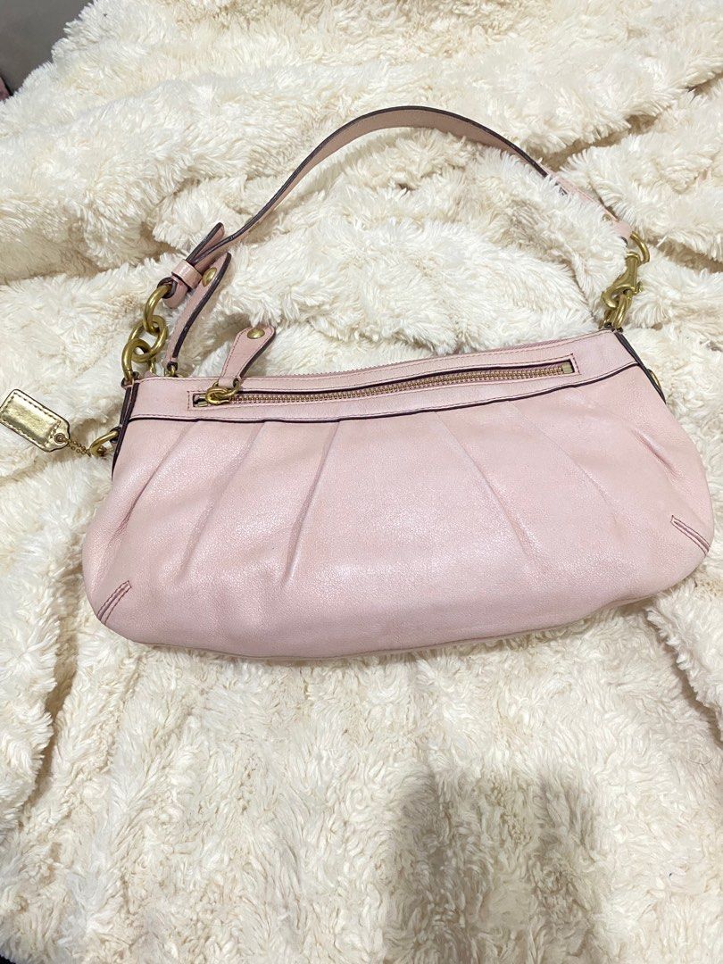Coach Pink Leather shoulder bag handbag (Category: Luxury Bags & Wallets) located in Bulacan. Submitted by marisolugay (Listing ID 1401990519, Image 3). Description: Issue mejo fade ang pagka pink nya my konting crack ang creed serial Number sa loob sign of usage - Authentic Coach handbag - Made of pink leather - Features a zip closure - Includes a handle - Gold-tone hardware - Interior Coach label - Pleated design - Small Coach tag - Serial numb