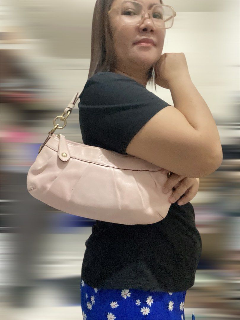 Coach Pink Leather shoulder bag handbag (Category: Luxury Bags & Wallets) located in Bulacan. Submitted by marisolugay (Listing ID 1401990519, Image 2). Description: Issue mejo fade ang pagka pink nya my konting crack ang creed serial Number sa loob sign of usage - Authentic Coach handbag - Made of pink leather - Features a zip closure - Includes a handle - Gold-tone hardware - Interior Coach label - Pleated design - Small Coach tag - Serial numb