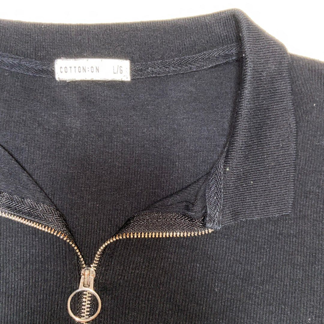 Cotton On Black Zip-Up Top (Category: Sleeveless) located in Manila. Submitted by sshshm (Listing ID 1402016517, Image 2). Description: Cotton On black zip-up top. Size L/G. Short sleeves, collared neckline, and ribbed fabric..