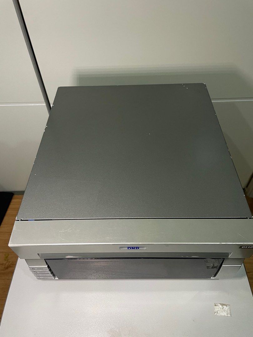 DNP DS40 Photo Printer (Category: Printers, Scanners & Copiers) located in Paranaque City. Submitted by seb_trading (Listing ID 1402067638, Image 2). Description: DNP DS_40 Photo Printer For use with photobooth or other photo printing. Good working condition. Print count around 13k prints Will come with 4 x 6 inch paper inside, around 100 prints, USB printer cable, power cord. Note: will only print 4 x 6 size prints, does not print photo strips –