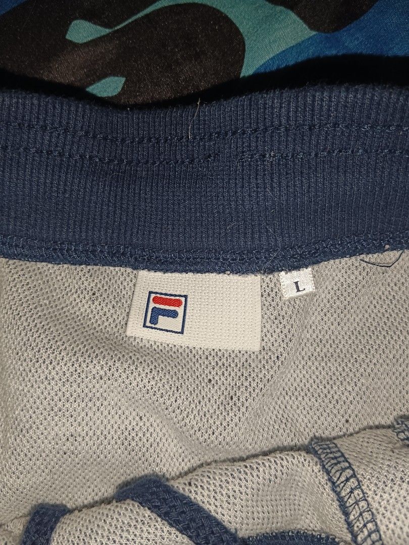 Fila Skirt - Size L (Category: Skirts) located in San Juan City. Submitted by vrncrosetejk (Listing ID 1402027917, Image 2). Description: - Fila skirt - Size: L - Color: Heathered grey - Waistband: Navy blue - Design: Pleated - Features: Small Fila logo - Lining: White.