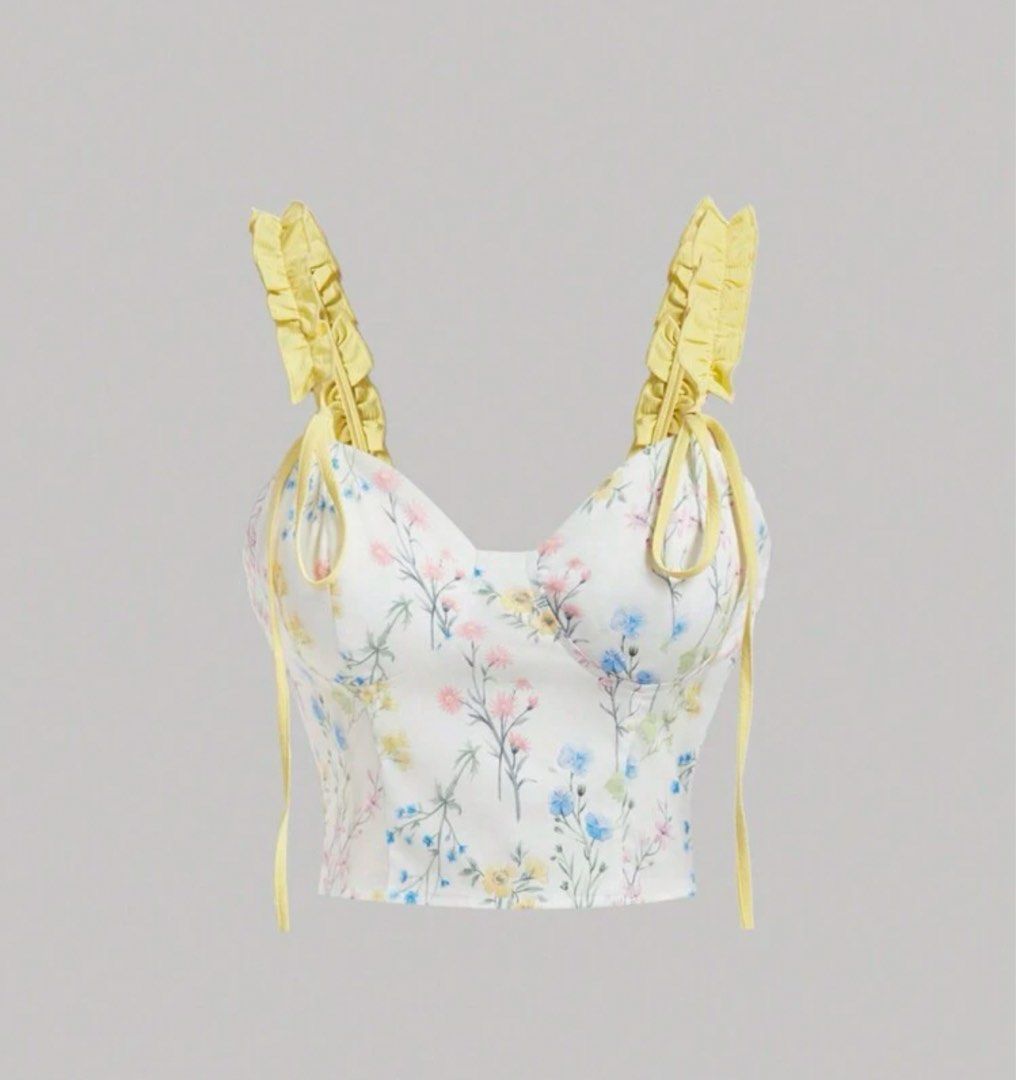 Yellow Sleeveless Floral Print Ruffle Strap Top (Category: Sleeveless) located in Manila. Submitted by chenelinn (Listing ID 1402086475, Image 1). Description: ✃ ┈ KINDLY READ !! 𖦹 ⋆｡° 📩 DM for more inquiries ✃ ┈ color may vary due to lighting 𖦹 ⋆｡° ✦ Cutesy floral top (sewed in some lace on the bottom ends: see last pic for reference) ✦ Adjustable yellow ruffle straps with tie details! ✦ Perfect for a summer and feminine look 🌻 ✦ Original pr