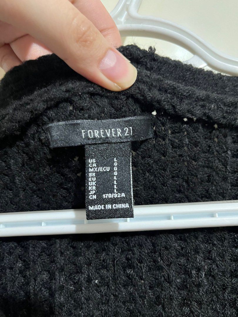 Forever 21 Black Knit Cardigan (Category: Coats, Jackets and Outerwear) located in Quezon City. Submitted by andeeclutters (Listing ID 1402006976, Image 3). Description: Preloved F21 Black Knit Cardigan - L in tag - runs big - can bundle with the cream, 1500 for both 💰Payment options: Gcash, Maya, BPI, UB 🛵 Delivery options: Lalamove/Grab, J&T/LBC.