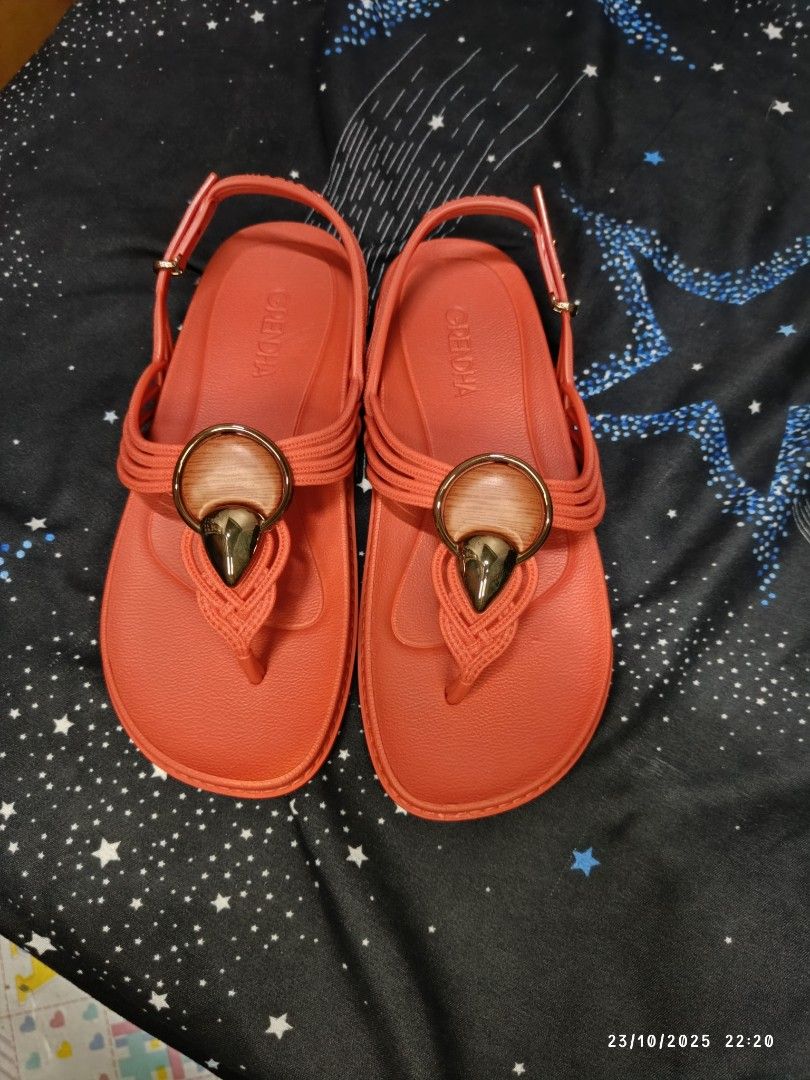 Grendha Celebrar Sand - Brown Tile Sandals (Category: Flats & Sandals) located in San Jose del Monte. Submitted by twinkletoes_ph (Listing ID 1402054700, Image 2). Description: Grendha Celebrar Sand sandals in brown tile color. Features a thong style with an adjustable strap. The sandals have a decorative element on the upper. The size is 7. Comes with the original box. Made in Brazil..